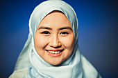 Young woman wearing blue silk hijab