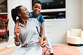 Portrait playful, mother and son