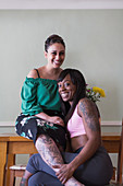 Portrait lesbian couple with tattoos