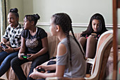 Tween girl friends playing video game