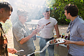 Male friends enjoying barbecue