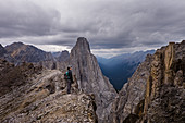 Female hiker at craggy, mountaintop, Canada
