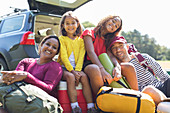Portrait family camping, unloading car
