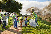 Volunteers cleaning up litter in park