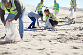 Mother and son volunteers cleaning up litter