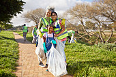 Portrait women volunteering, cleaning up litter in park