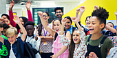 Portrait enthusiastic students and teachers cheering