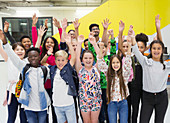 Portrait enthusiastic students and teachers cheering