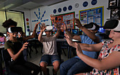 school students using virtual reality simulators