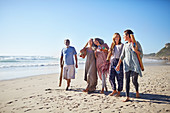 Friends walking with yoga mats