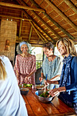 Women preparing healthy meal in hut