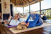 Yoga class stretching in hut