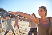 Confident woman practicing warrior 2 pose