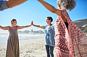 Women joining hands in circle