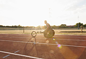 Young paraplegic athlete training for wheelchair race