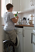 Young woman preparing tea