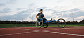 Determined paraplegic athlete training for wheelchair race