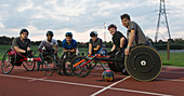 Portrait paraplegic athletes training for wheelchair race