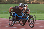 Determined paraplegic athlete in wheelchair race