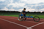 Portrait paraplegic athlete training for wheelchair race