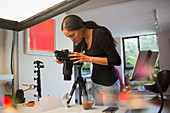 Female photographer working in studio