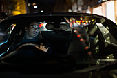Man driving car at night
