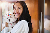 Portrait happy young woman with dog