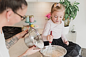 Mother and daughter baking