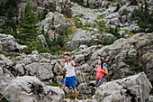 Couple hiking through rugged landscape