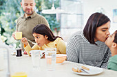 Affectionate family enjoying breakfast