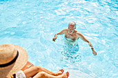 Mature man in summer swimming pool