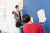 Family painting wall