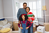 Portrait happy family moving house