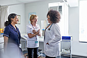 Female doctor and nurses talking