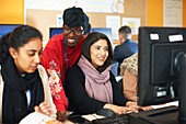 Female college students using computers in computer lab