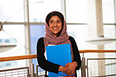 Young female college student wearing hijab