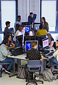 Students and teachers using computers in computer lab