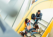 Junior high students talking on stairs