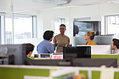 Business people meeting in open plan office