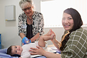 Mother with baby daughter and paediatrician