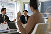 Businessmen talking in conference room meeting