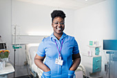 Portrait confident, female nurse in hospital room