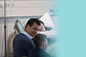 Family visiting patient in hospital room