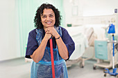 Portrait female orderly cleaning hospital ward