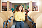 Portrait young female college student in computer lab