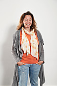Portrait woman wearing scarf sweater and jeans