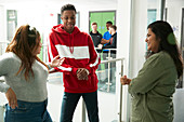 College students talking in corridor