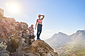 Portrait woman hiking sunny cliff Cape Town South Africa