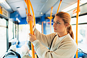 Woman riding bus