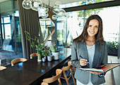 Portrait businesswoman working at home